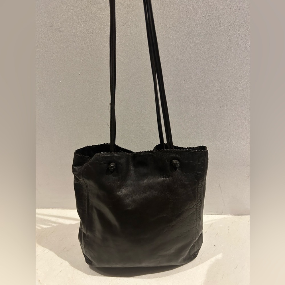 Gorgeous dark brown leather rugby North America bag.